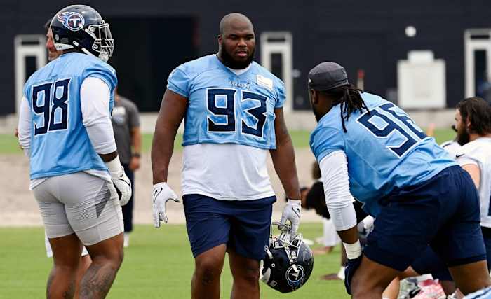 Tennessee Titans defensive tackle Teair Tart (93) talks with Denico Autry (96) during an NFL football minicamp Wednesday, June 7, 2023, in Nashville, Tenn.